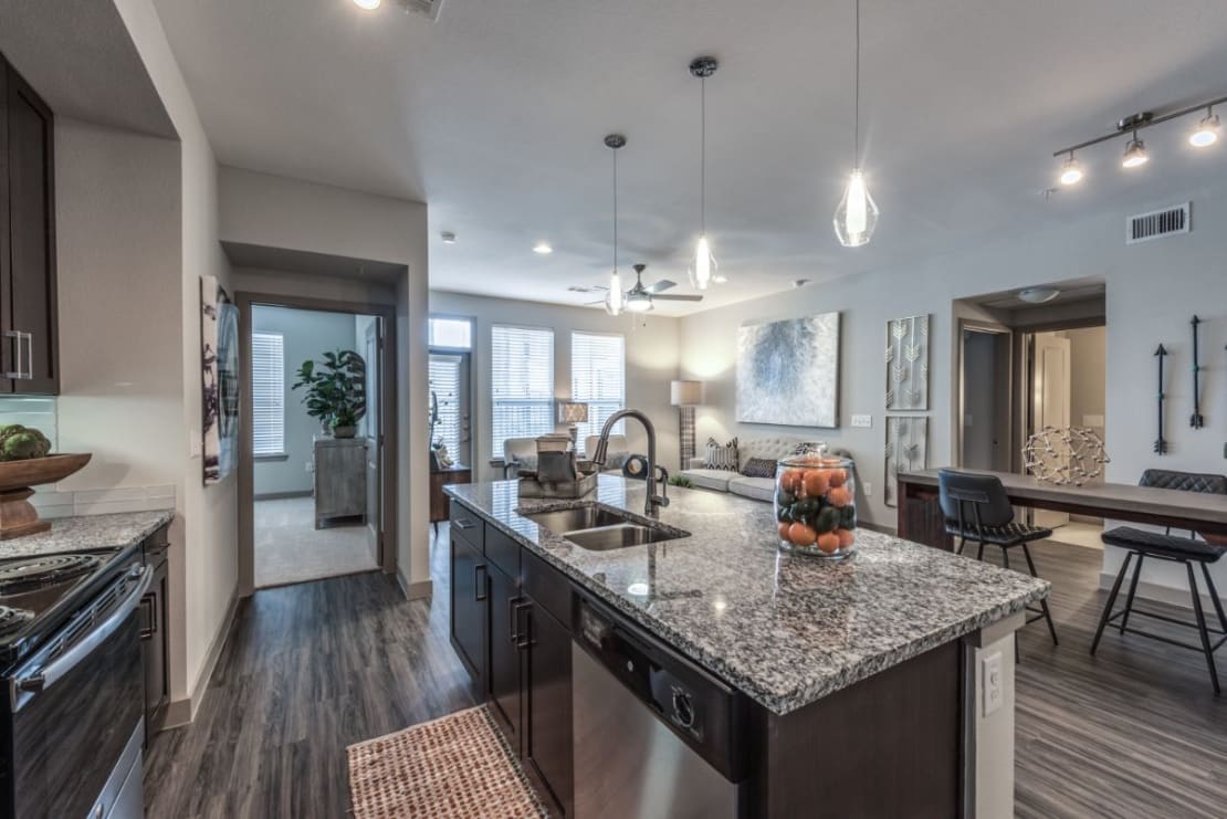 Kitchen with island and view of living area